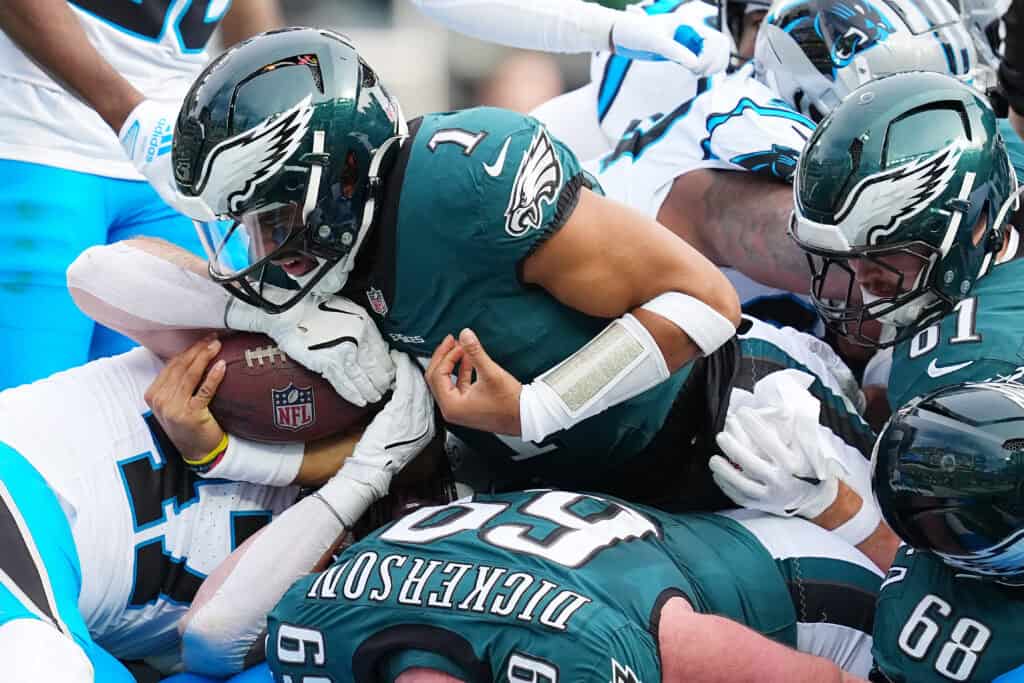 PHILADELPHIA, PENNSYLVANIA - DECEMBER 08: Jalen Hurts #1 of the Philadelphia Eagles scores a touchdown in the second quarter of a game against the Carolina Panthers at Lincoln Financial Field on December 08, 2024 in Philadelphia, Pennsylvania.