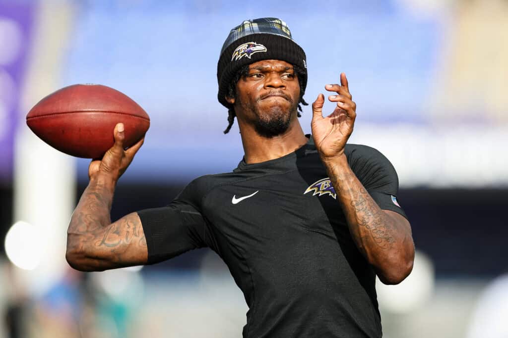 BALTIMORE, MD - AUGUST 09: Lamar Jackson #8 of the Baltimore Ravens warms up before a preseason game against the Philadelphia Eagles at M&T Bank Stadium on August 9, 2024 in Baltimore, Maryland.