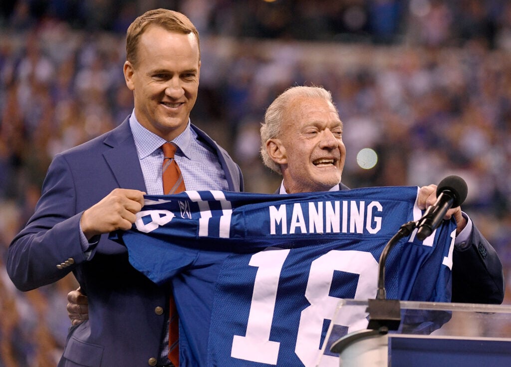INDIANAPOLIS, IN - OCTOBER 08: Peyton Manning and Jim Irsay, owner of the Indianapolis Colts, pose for photos during a ceremony retiring Manning's jersey during the halftime of the game between the Indianapolis Colts and the San Francisco 49ers at Lucas Oil Stadium on October 8, 2017 in Indianapolis, Indiana.
