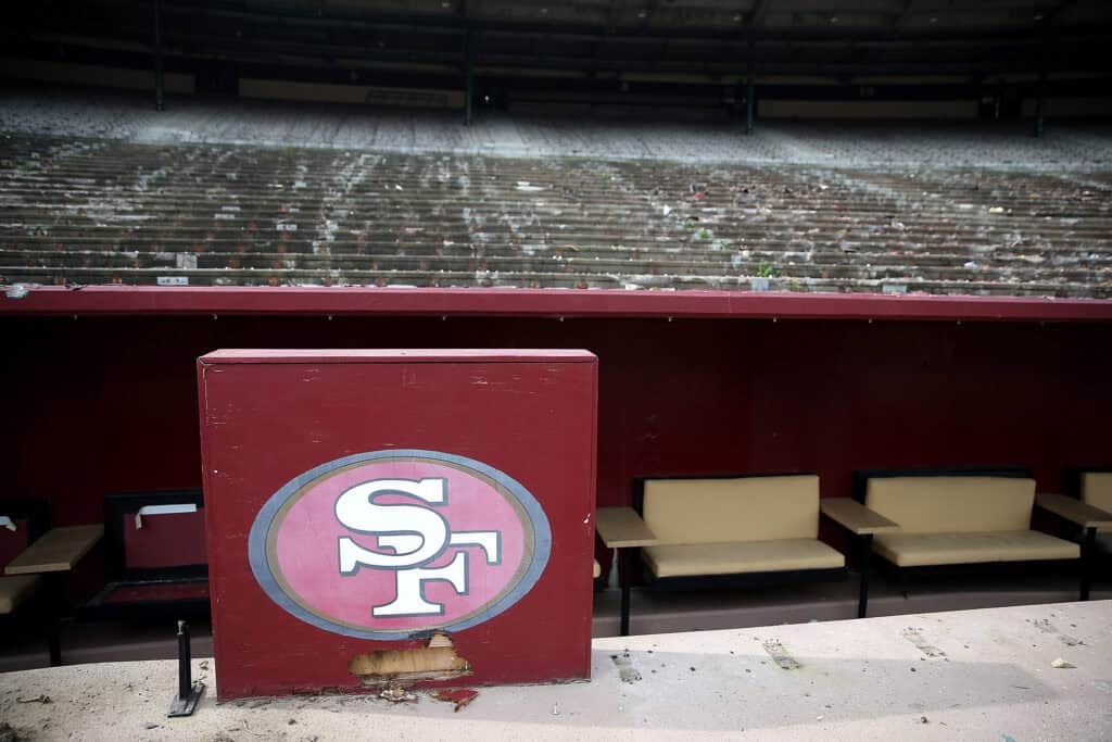 SAN FRANCISCO, CA - FEBRUARY 04: A San Francisco 49ers logo remains in front of an empty section of seating inside Candlestick Park on February 4, 2015 in San Francisco, California. The demolition of Candlestick Park, the former home of the San Francisco Giants and San Francisco 49ers, is underway and is expected to take 3 months to complete. A development with a mall and housing is planned for the site.