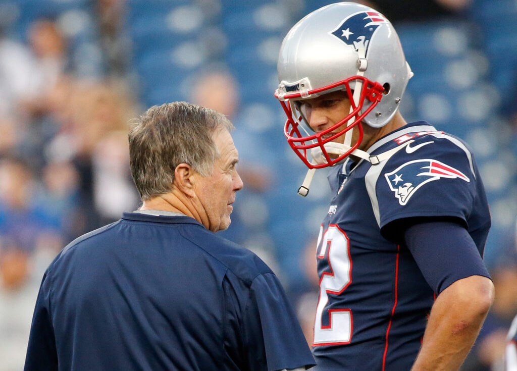 FOXBORO, MA - AUGUST 31: Bill Belichick of the New England Patriots and Tom Brady #12 chat before a preseason game with the New York Giants at Gillette Stadium on August 31, 2017 in Foxboro, Massachusetts.