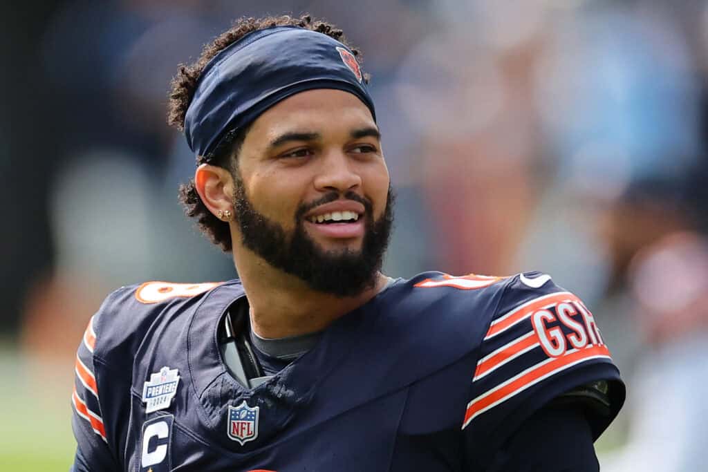 CHICAGO, ILLINOIS - SEPTEMBER 08: Caleb Williams #18 of the Chicago Bears participates in warmups prior to a game against the Tennessee Titans at Soldier Field on September 08, 2024 in Chicago, Illinois. The Bears defeated the Titans 24-17.