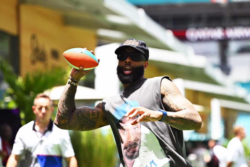 Odell Beckham Jr plays football in the Paddock prior to the F1 Grand Prix of Miami at Miami International Autodrome on May 05, 2024 in Miami, Florida.
