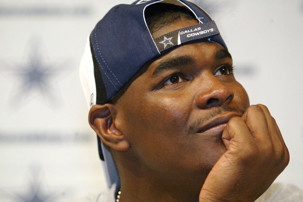 IRVING, TX - MARCH 22: Keyshawn Johnson listens to Dallas Cowboys owner Jerry Jones during a media conference to announce his signing by the Cowboys on March 22, 2004 at Valley Ranch in Irving, Texas.