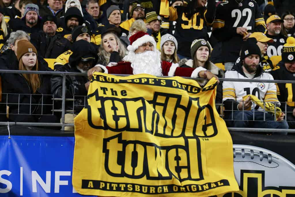 A Pittsburgh Steelers fan is dressed as Santa Claus during the game against the Baltimore Ravens at Heinz Field on December 05, 2021 in Pittsburgh, Pennsylvania.
