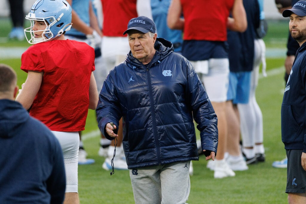 CHAPEL HILL, NORTH CAROLINA - APRIL 12: Head coach Bill Belichick of the North Carolina Tar Heels coaches during North Carolina's "Practice Like A Pro" Spring Football Event at Kenan Stadium on April 12, 2025 in Chapel Hill, North Carolina.