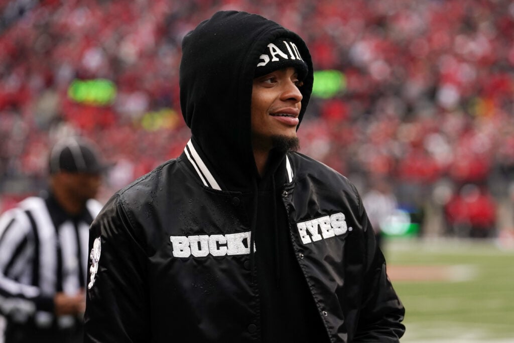 COLUMBUS, OHIO - NOVEMBER 23: Former Ohio State Buckeyes player Justin Fields looks on from the sideline during the game between the Indiana Hoosiers and the Ohio State Buckeyes at Ohio Stadium on November 23, 2024 in Columbus, Ohio.