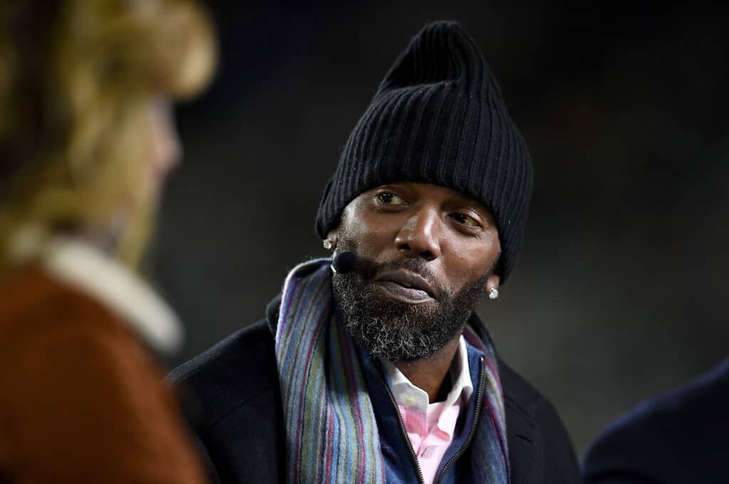 ESPN analyst Randy Moss looks on before the game between the Green Bay Packers and the Detroit Lions at Lambeau Field on October 14, 2019 in Green Bay, Wisconsin.