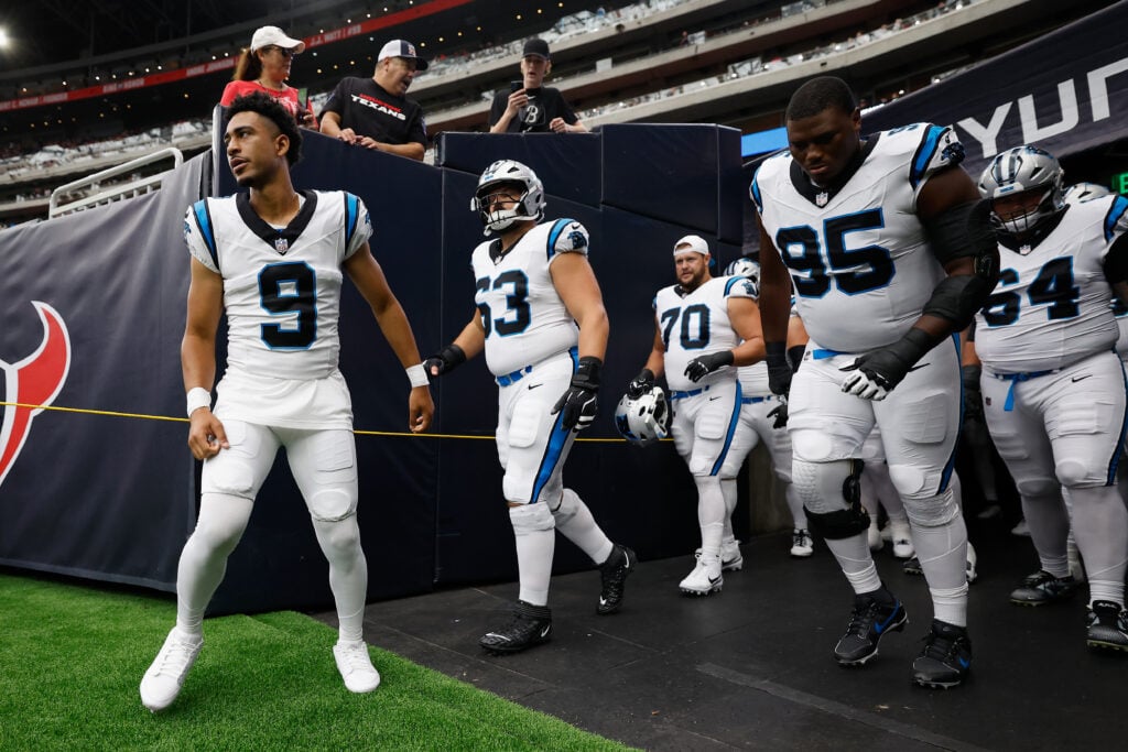 HOUSTON, TEXAS - AUGUST 16: Bryce Young #9 of the Carolina Panthers leads the team onto the field before the NFL Preseason 2025 game against the Houston Texans at NRG Stadium on August 16, 2025 in Houston, Texas.