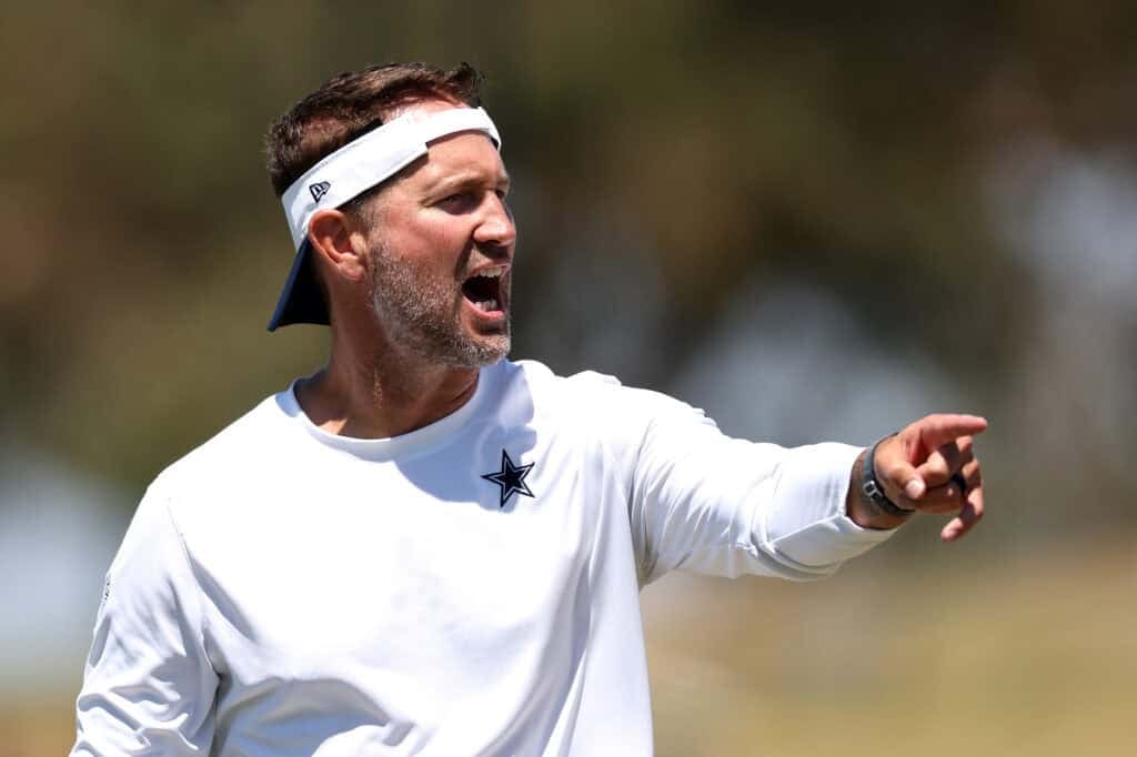 OXNARD, CALIFORNIA - AUGUST 07: Head Coach Brian Schottenheimer of the Dallas Cowboys reacts during Day 12 of Dallas Cowboys Training Camp at Staybridge Suites Oxnard on August 07, 2025 in Oxnard, California.