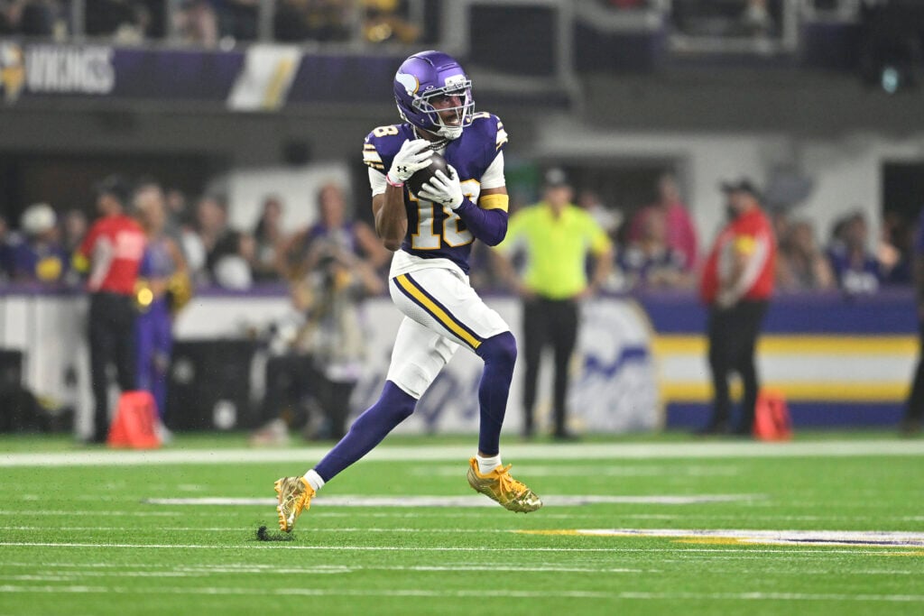 MINNEAPOLIS, MINNESOTA - SEPTEMBER 14: Justin Jefferson #18 of the Minnesota Vikings catches a pass against the Atlanta Falcons during the second quarter in the game at U.S. Bank Stadium on September 14, 2025 in Minneapolis, Minnesota.