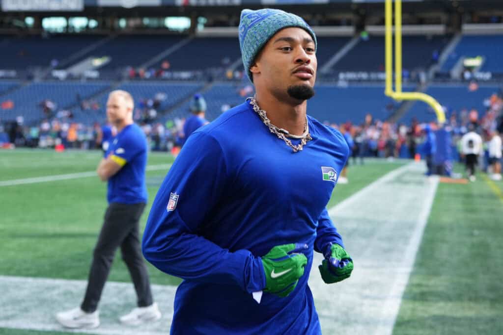 SEATTLE, WASHINGTON - OCTOBER 05: Jaxon Smith-Njigba #11 of the Seattle Seahawks warms up prior to a game against the Tampa Bay Buccaneers at Lumen Field on October 05, 2025 in Seattle, Washington.